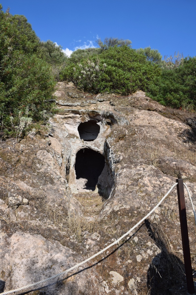 A Punic tomb, excavated in the tuff, under an ancient 'Domus de Janas'.