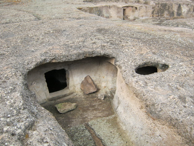 This tomb has large courtyard approach to its rock cut chamber.  October 2010.