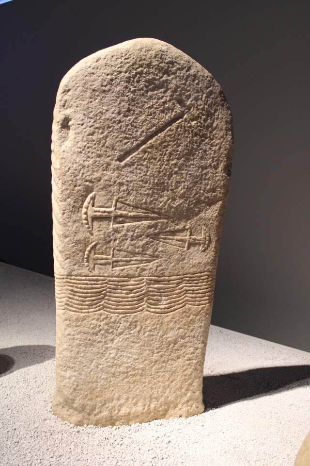 Male stela with belt, battleaxe and daggers, depiction of cloak on the reverse, Marble. 3000 - 2500 BC, Italy, Trentino-South Tyrol, Arco. 