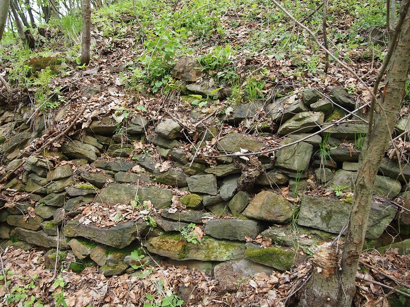 Unearthen destruction of the stone walls