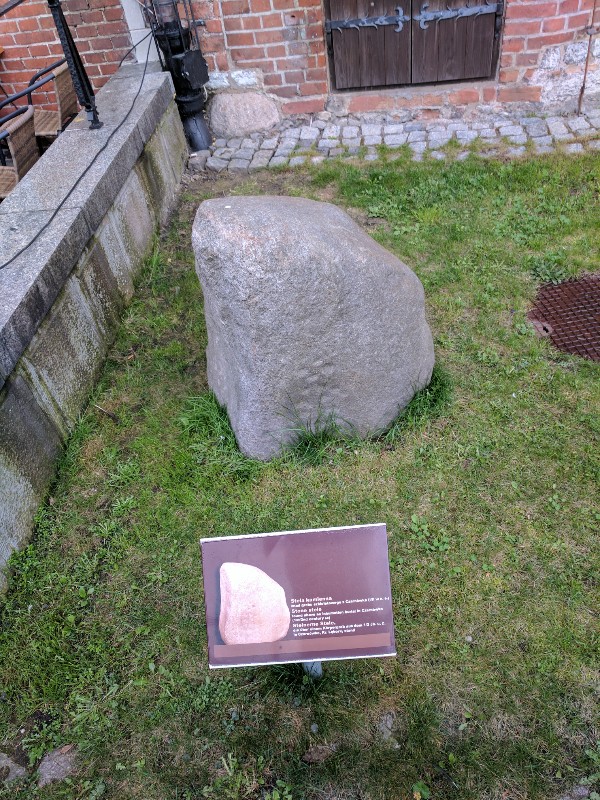 Site in Kujawsko-pomorskie Poland. Stone stele with cup motifs, found marking an inhumation burial at what is now Czarnowka, near Warsaw, Poland. The stele is dated to the first to second century AD and now forms part of a collection of five stones on the harbourside at Dlugie Pobrzeze, Gdansk, outside the archaeological museum.