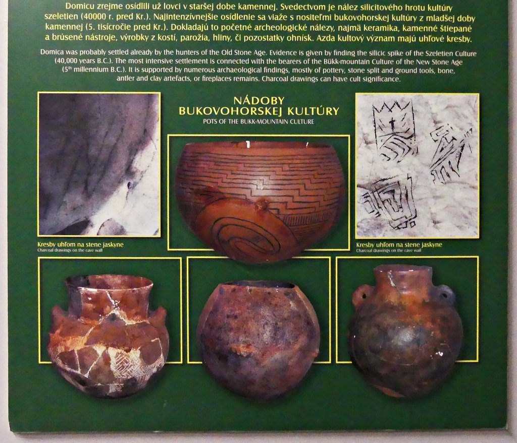 Information board (bottom part) about the neolithic life, entrance hall.  Of particular interest is the top right photo, showing carbon drawings made onto walls inside the cave.  June 2017.