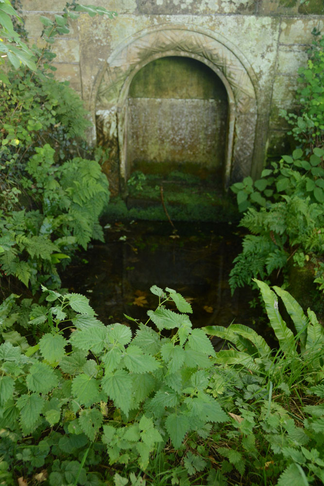 Close up of the well head with its small rectangular pool below.  The water was at a depth of about 12-15 cms.