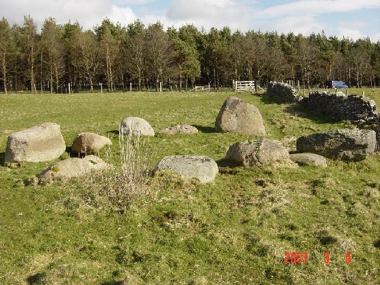 The 'circle' looking East. Is this really a circle or a cairn no longer covered in soil? The 'stone row' lies to the South