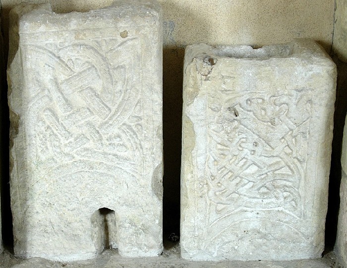 The two Saxon Cross fragments which are immediately in front of you when entering the church.