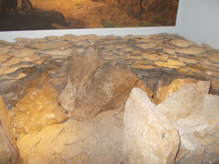 The reconstructed chamber of Hazleton long barrow in Cirencester Museum.