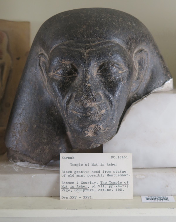 Black Granite Head from the Temple of Mut in Asher , Karnak.  Possibly Mentuemhat (700BC to 650BC) who was a Thebian Official.  There is a complete statute of him in the Neues Museum in Berlin.  April 2015  