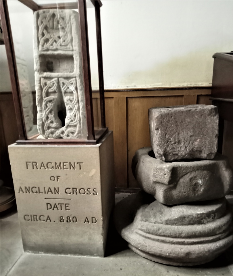 The cross shaft in its box along with some other elderly stones.