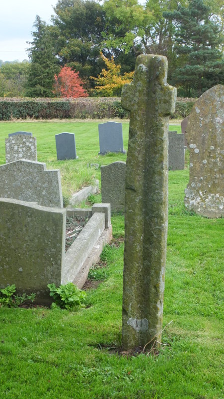 Llanveyno Cross, believed to be 10th century.  Found buried in 1870 nearby and brought to the church for safe keeping.  Groove thought to be a libation channel.