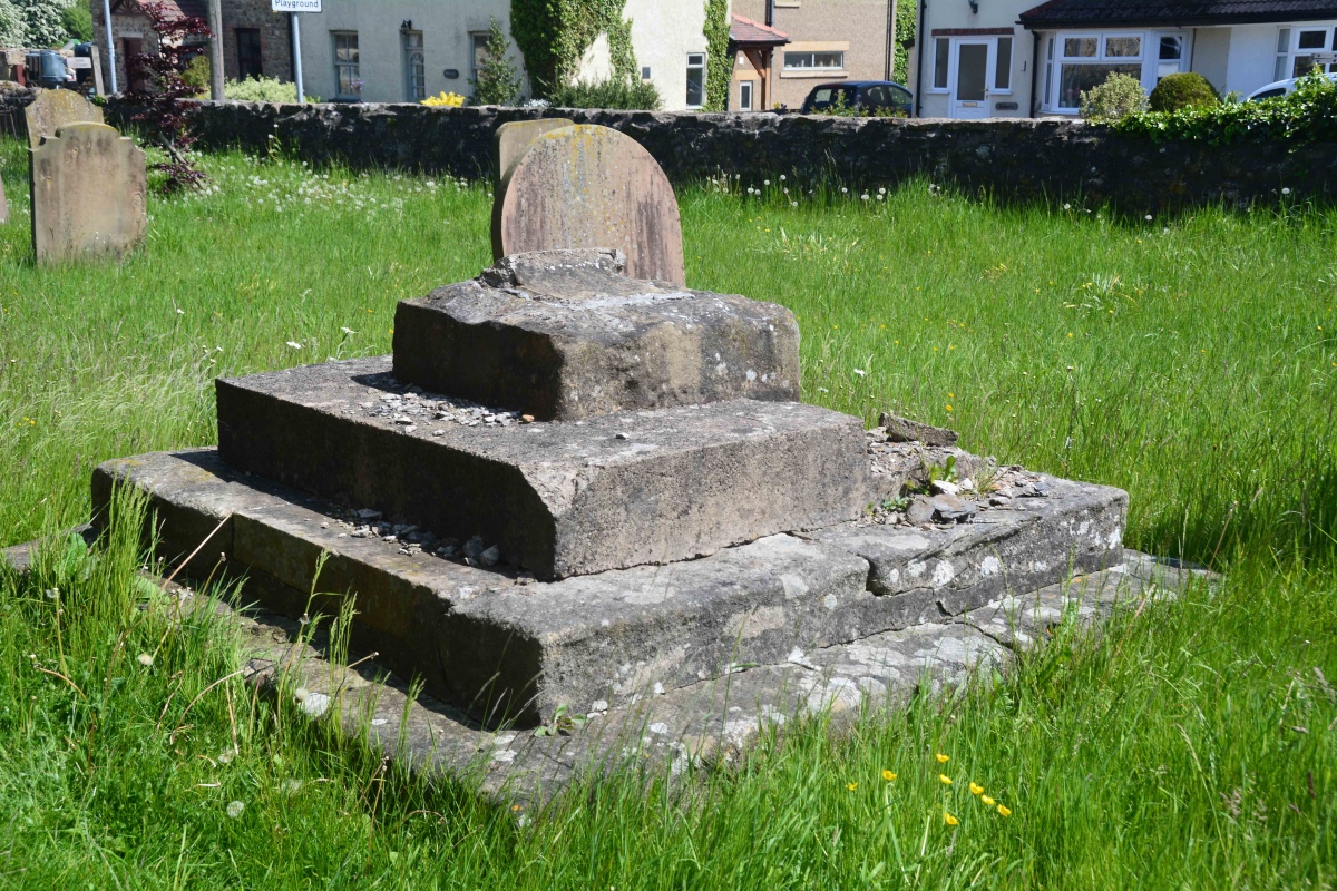 The cross base from the external south wall of the nave, looking eastwards down Church Street. 