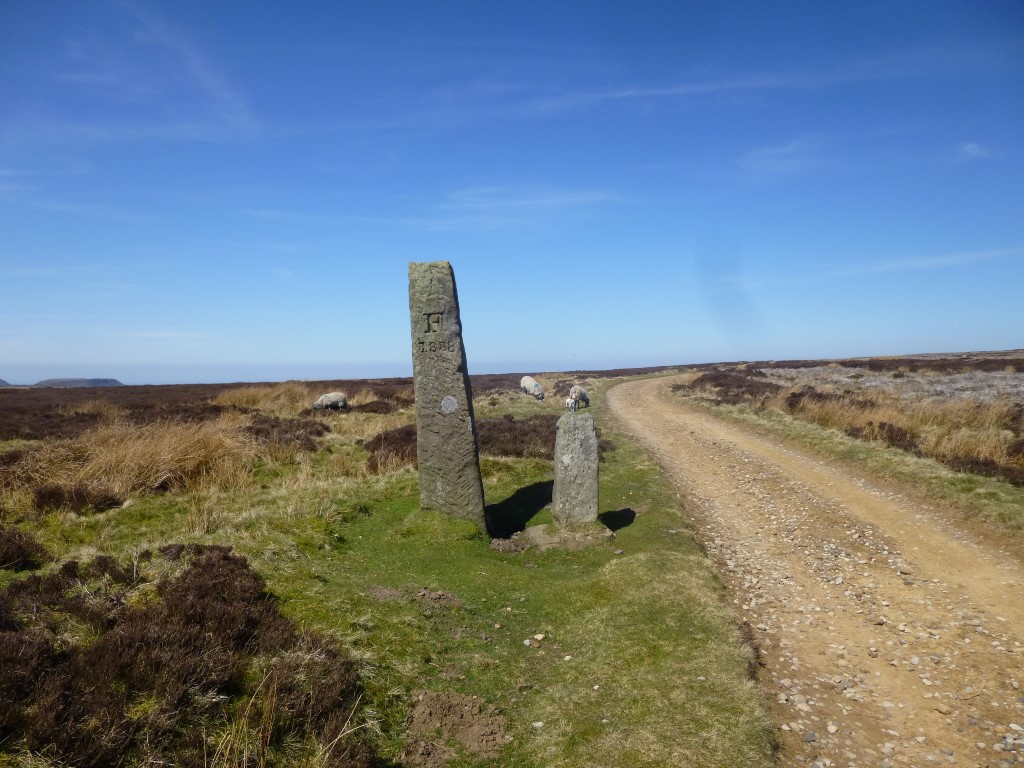 Jenny Bradley Cross and Feversham Estate boundary stone looking north taken April 2016
The large boundary stone next to the cross has Sir W Fowels engraved into it on the north side with F 1838 engraved into the south side. On the west face it says Cross TA 1768.