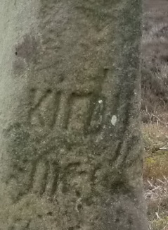 Guide Stone at SE 61204 95435  - Close up of markings on east face, image taken April 2014.  Hayes in his 1988 publication “Old Roads and Pannierways in North East Yorkshire” page 41 says this inscription reads ‘This Kirby Road’ (Kirkbymoorside). Well I can’t see the word ‘This’ at all and there is no indication that it was ever there. ‘Kirby’ is clear enough as for the word unde