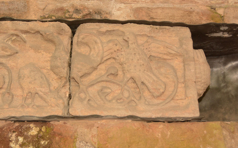 The 6th, westernmost, of the panels in this frieze, in the south wall of the south aisle. It appears to be a continuation of the previous panel (stone 5) with cock like birds strutting and displaying.