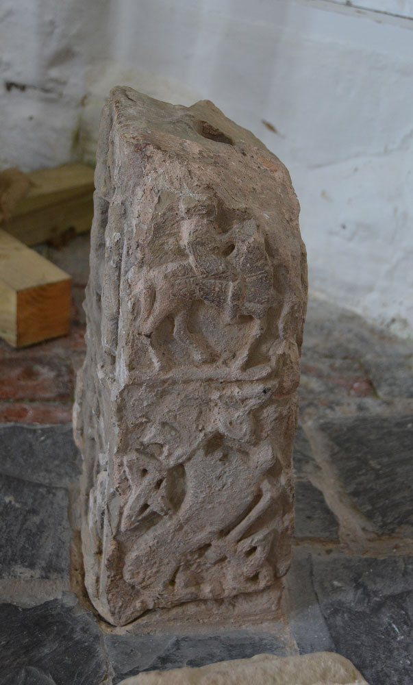 The eastern face of the westernmost cross in the group of three at the west end of the north aisle (described as '20' in the Church Guide'). This face also shows two panels, the top being a mounted warrior, the lower intertwined beasts. The Church Guide says 