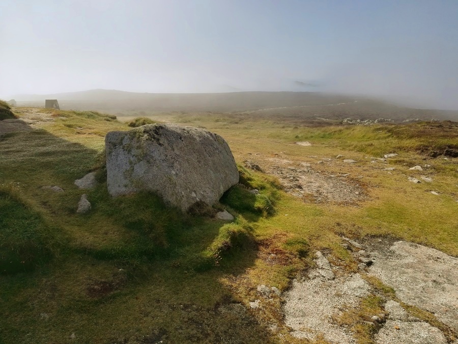 A remaining Large Kerbstone at St Martin's Head Day Mark Cairn on a moody misty may morning