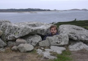 Yours truly poking myself through the capstones of Bant's Carn. I don't know why I was looking so miserable, probably because the view towards the northern isles of Scilly was behind me.