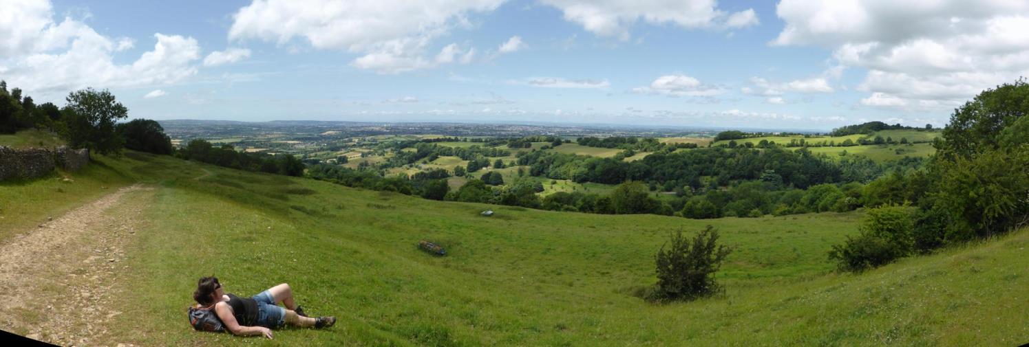 Panorama from the north western slopes of the promontory fort. The fort itself on the top of the plateau behind. The scarp of the hill has been shaped.