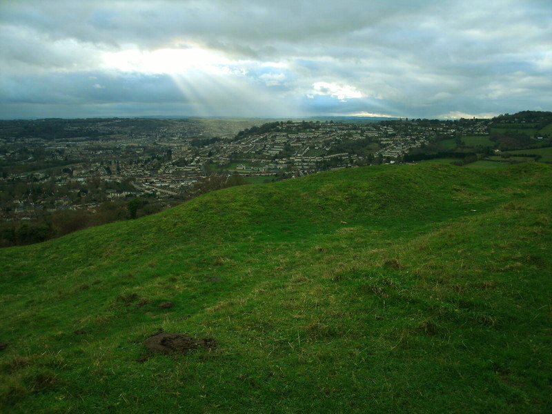 Solsbury Hill, looking south west at the sunlight shining on Bath.