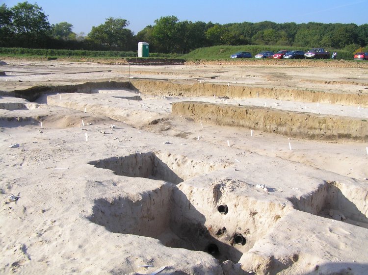 Open Day at the North Park Farm Mesolithic Excavation - you can see how the 'trenches' have been arranged, as a patchwork of squares. The one in the front with the pipes has been dated, see the next image for a close-up