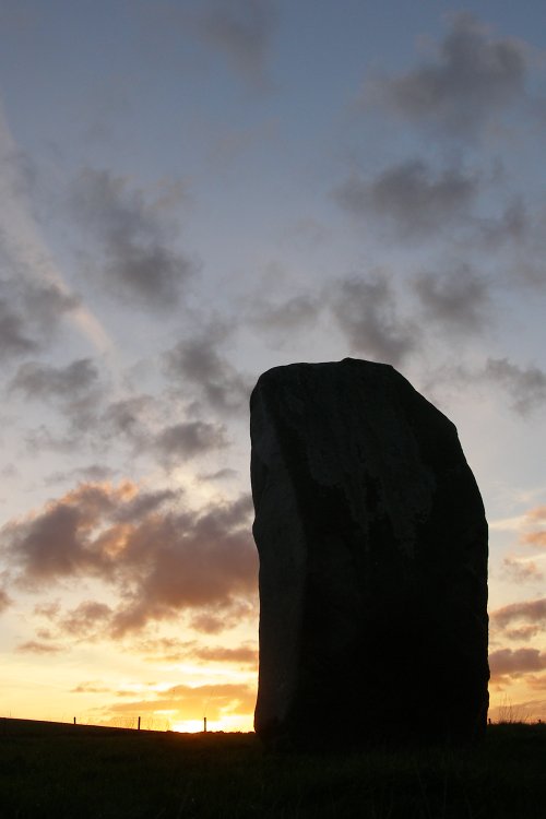 Autumn sunset behind one of the West Kennet avenue stones.
