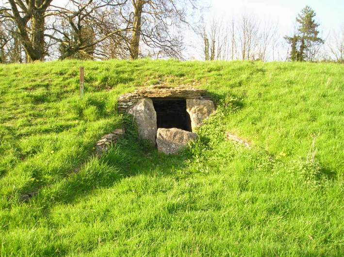 Lanhill, Chambered Tomb, near Chippenham, Wiltshire, ST877747

At the centre of the southern side is a rock lined chamber, about 2½ m in length by 1½ metres in width, which has obviously been restored, as the roof is now supported on steel bars. The opening to the chamber has a curved, dry stone walled forecourt, and there is a blocking stone across the opening. 