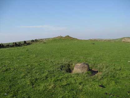 Charles Head tumulus stands at 372m above seal level on a N-S trending hilltop with steep slopes west and eastwards.
 With Further Harrop tumulus it flanks the present Macclesfield Road and Bakestonedale Road as they broach the summit of their rise from the Cheshire Plain before immediately descending to Kettleshulme and the valley of the River Goyt.
  100m south of the tumulus, this 1m semi-sun