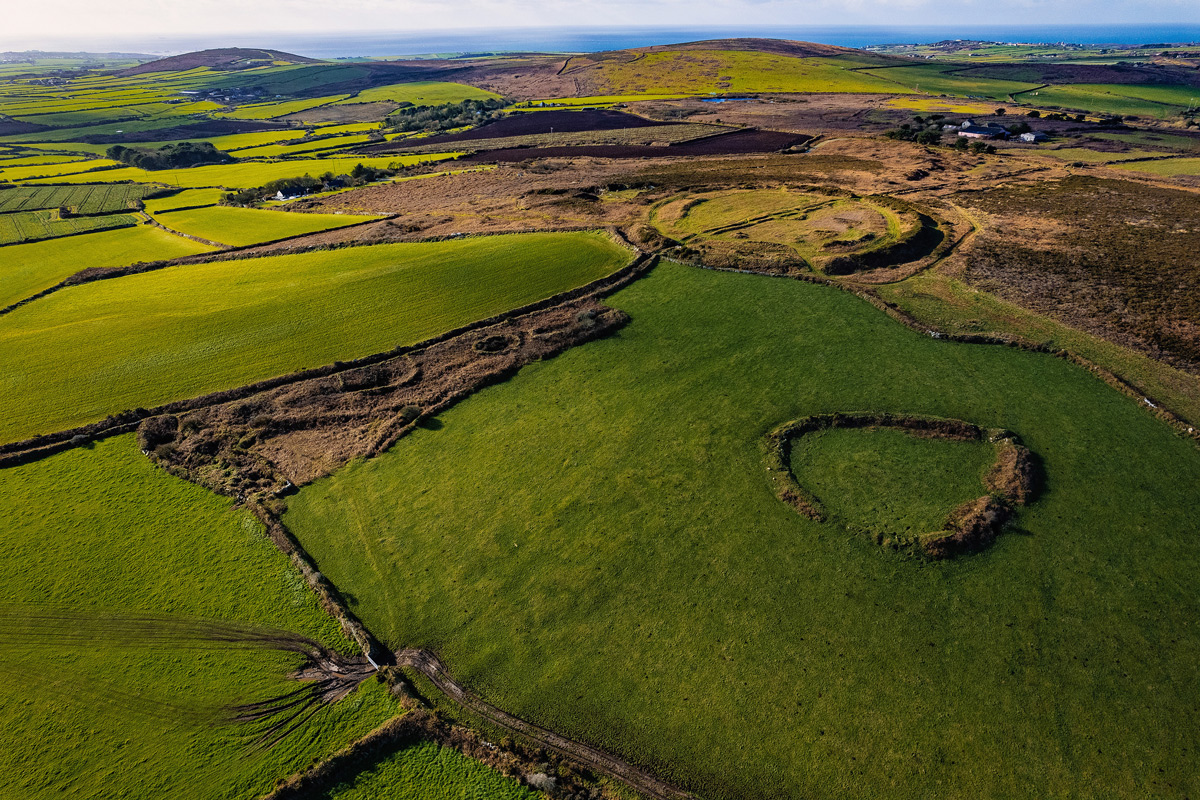 A wonderful photo by The Cornwall Heritage Trust of the Enclosure (Bottom Right) then Caer Bran Fort above it and in the background on the right is Bartine hill which also has an ancient enclosure and ring cairns on it, In the background on the left is Carn Brea, Again with it's own Cairns