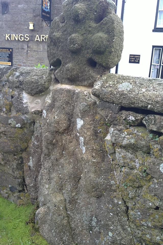 At some time before 1896 the cross head was cemented onto a boulder and the churchyard wall built up around it.