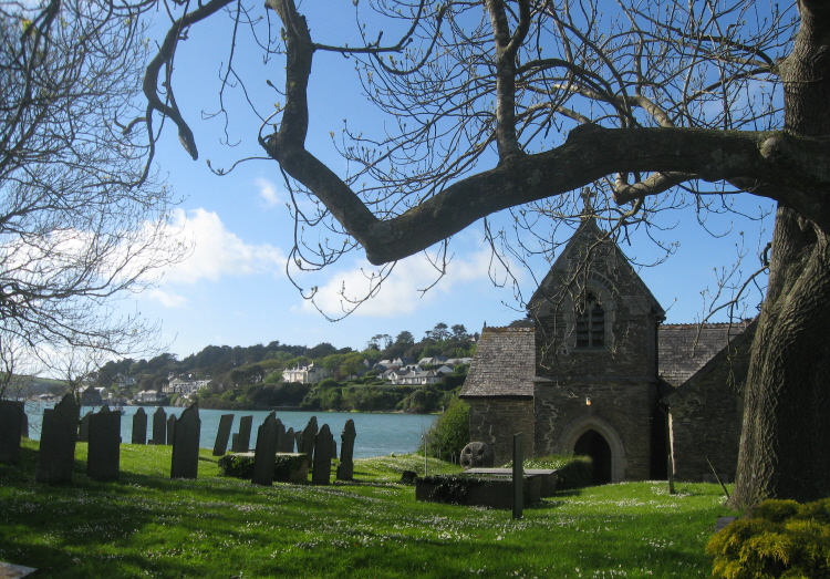St Michael's is in a very picturesque setting beside Porthilly Cove, across the R.Camel from Padstow.  The cross is just visible here, near the west wall of the church.