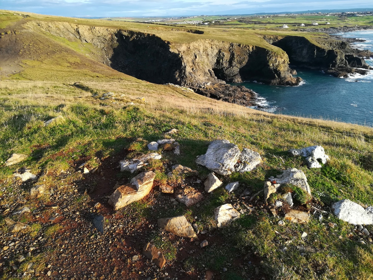 Stones (Part of a possible cist) on the top of Dinas Head Tumulus