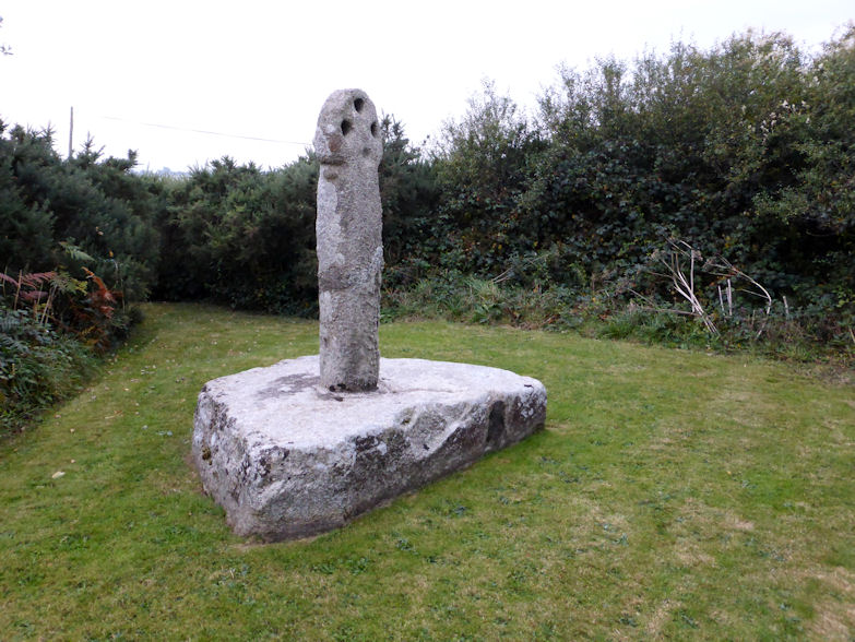 This lovely cross has been restored and remounted on a large granite base in a piece of land beside the busy junction. 