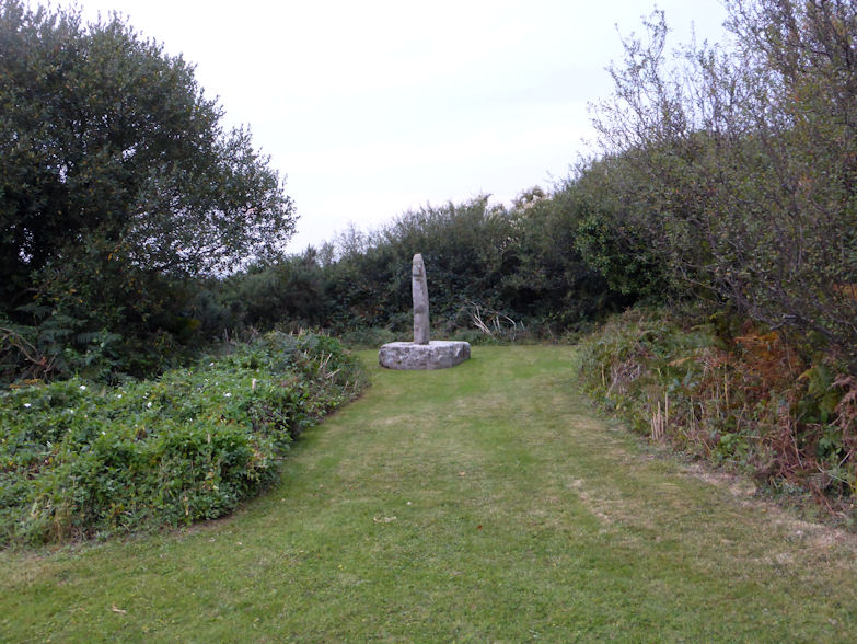 Near a multiple junction with the busy A39 a few miles to the north of Wadebridge, this lovely cross has been restored and remounted on a large granite base in a nice little piece of landscaped land beside the busy junction. 