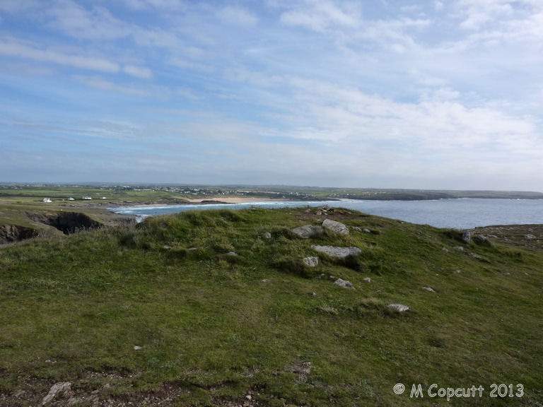 Right on the top of the headland is the remains of what is described as Tumulus. The mound is about 8 metres diameter, still more than one metre in height, and largely composed of white quartzy looking rock. 