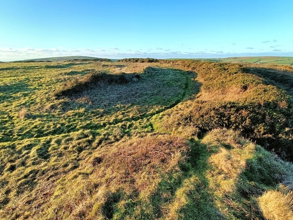 The Main bank of the fort is on the right and just above left of center is the slighter bank of the older enclosure