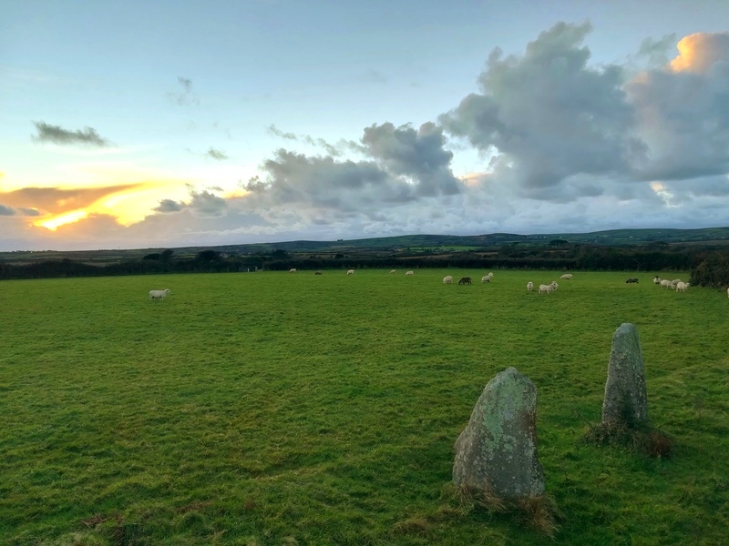 November Sunset at Faughan Settlement and it's Standing Stones within, Note how the near stone is at a right angle to the other stone, I believe that these two stones are the last remaining side stone/Back stone of a Neolithic/Bronze age quoit similar to others in the region, and then far later the two remaining stones were re-used (in situ) in the iron age as the 2 large entrance stones to the fo