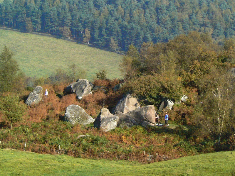 A circle of stone on the Castle Ring hillfort plateau, viewed from the summit of Robin Hood's Stride. 
