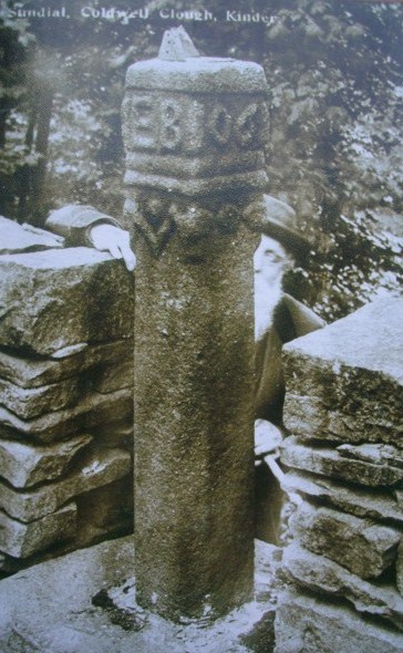 The Saxon cross shaft reused as a sundial at Coldwell Clough Farm, Hayfield. The gentleman behind is believed to be Mr Bradbury who built the farm and converted the cross shaft into the sundial. 