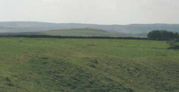 One of the many barrows visible from various points around Arbor Low circle-henge.  This barrow is located to the west of the monument at SK137636.