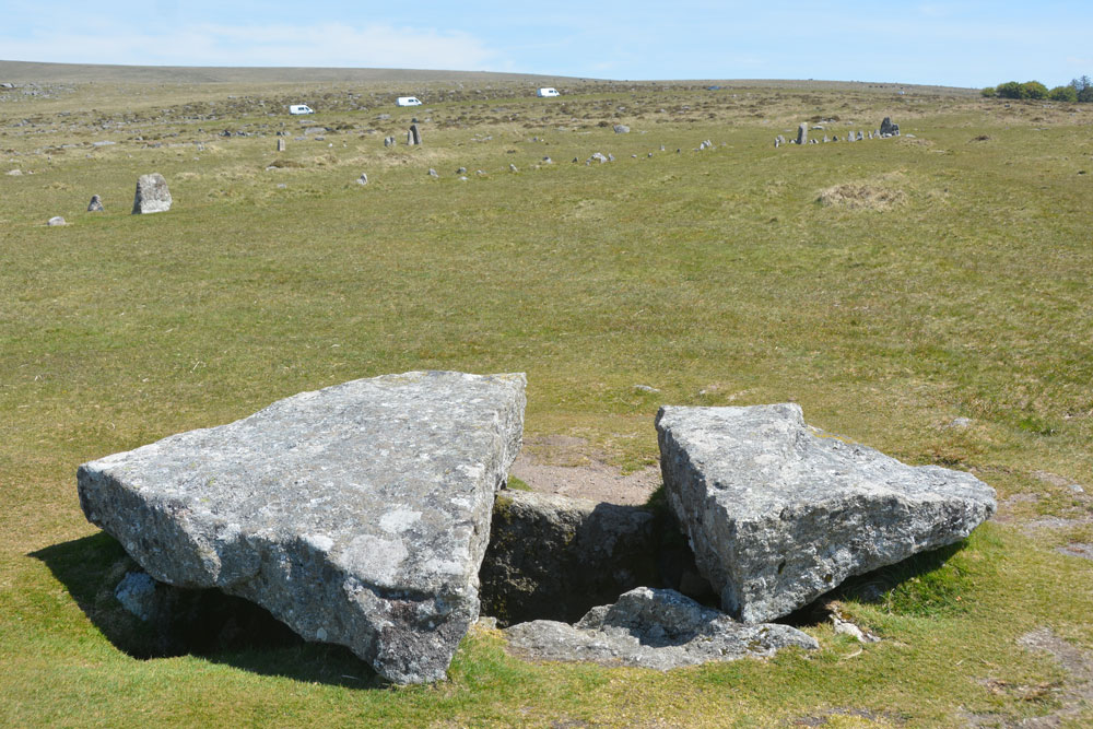 The Merrivale Cist with Merrivale 2/B row running from centre-left to centre/middle-top of the photo behind it. 
