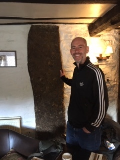 The stone, which extends 4 ft into room above and 17 feet below ground ( excavations in 30s and dowsed) 