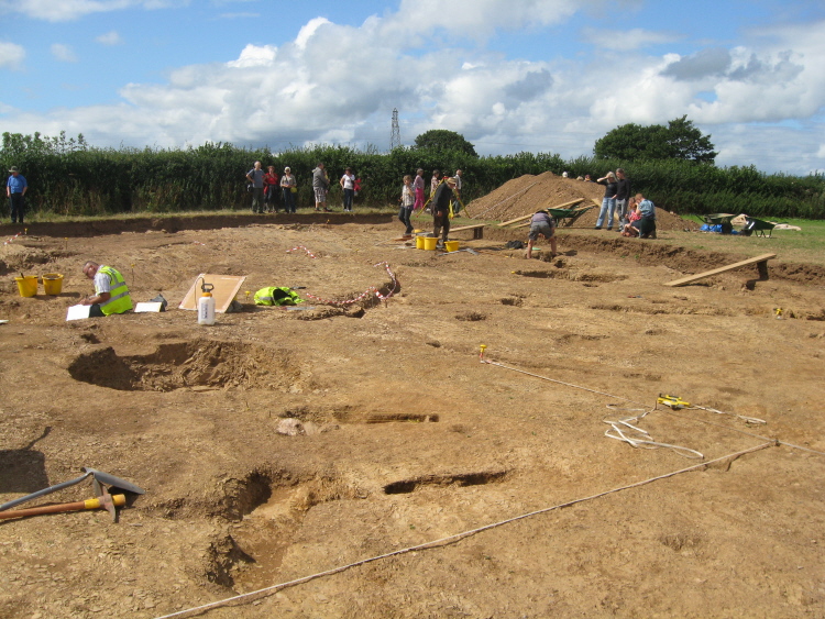 Looking towards the NW of the dig area, from a point to the right of the eastern ditch [that runs into the large ring ditch feature].