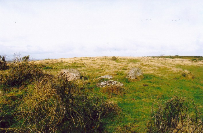 Stones of Cairn 1, centre, on approaching the circle from the south.  Trackway visible to right.