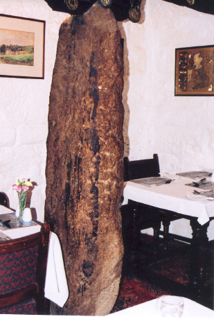 Another angle on the menhir at the Oxenham Arms, pictured on 5th Sept (07).  I found it in the small dining room - off the left of the  passage - behind the front bar.
It props up a beam but is otherwise free-standing.
Makes me wonder if there are two in this pub, as I didn't venture into the bar to check if there was one inlaid into the wall.
