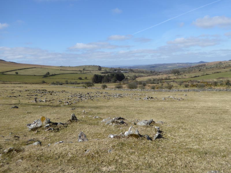 22mar15: Hut circle in foreground, settlement behind. View NW.