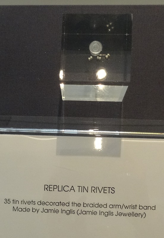 A replica of one of the 32 domed tin rivets that formed a bracelet.  This was exceptionally rare to find tin used in decorative objects at prehistoric sites in Britain.  (Apparently originally there were 35.) 