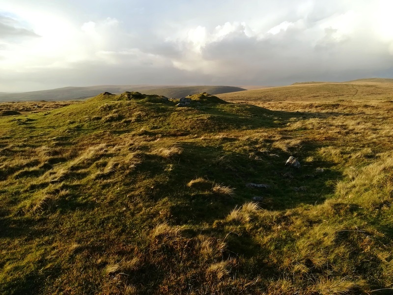 Butterdon Hill Barrow with a pit next to it