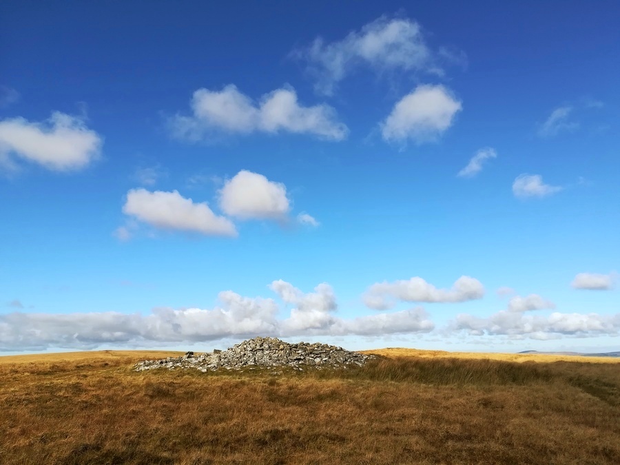 Snowdon Cairns (Dartmoor), the second cairn from the south is higher but smaller than it's larger southern neighbour. In the background on the right is the next smaller but higher cairn to the north
