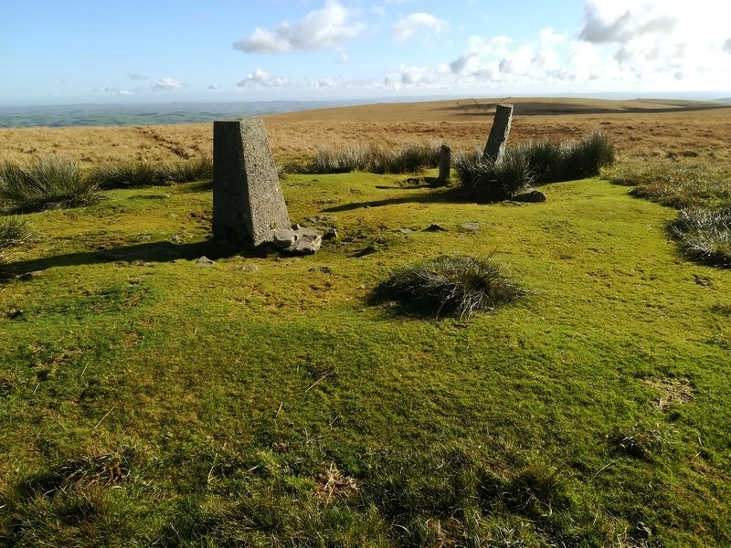 The top of Ryder's Hill Cairn, some of the cairns on Snowdon are visible in the background on the right