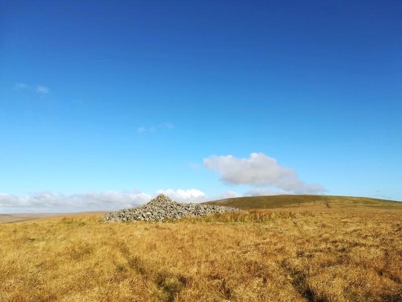 Sharp Tor cairn with 3 Barrow hill behind it

