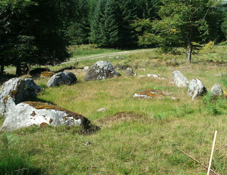 The Southern most hut of the group with the track you get to the site by in the background.